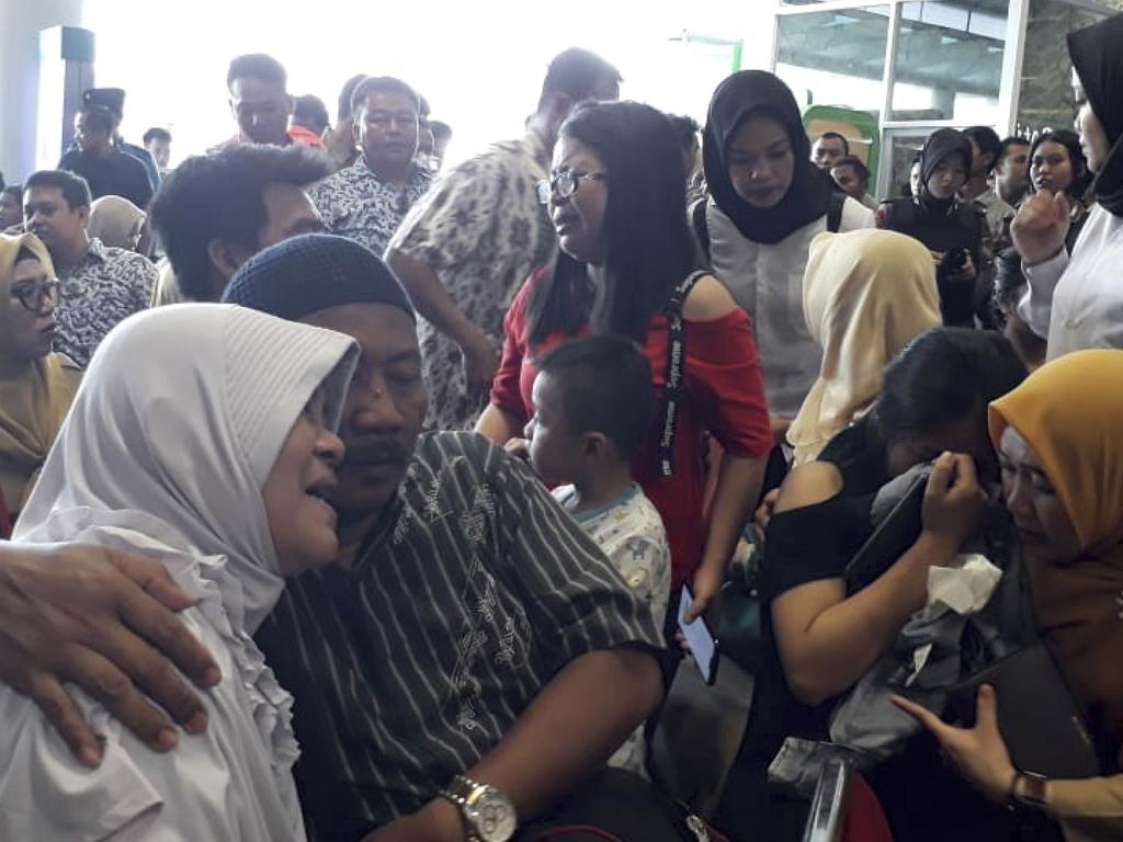 Relatives of passengers comfort each after Lion Air flight JT 610 crashed with 189 people on board. Picture: AP