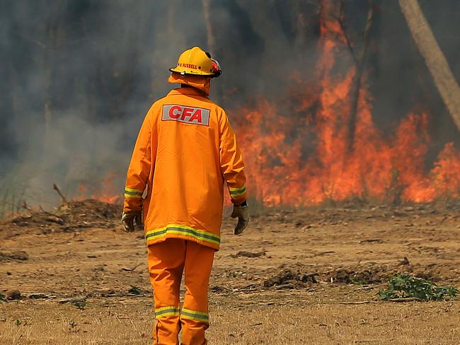 There is an out of control bushfire burning in the Bunyip State Park. CFA crews providing asset protection outside Gembrook. Picture: Mark Stewart