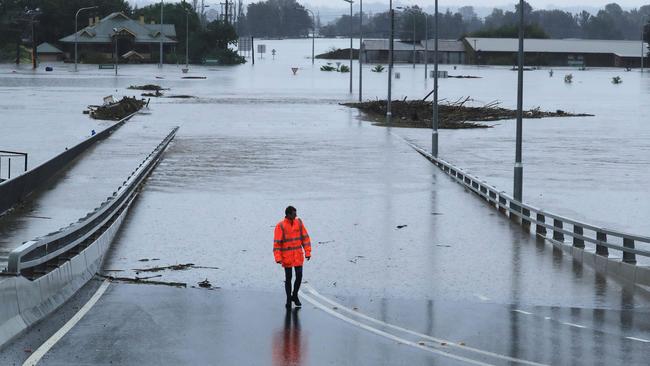 The bridge at Windsor in Sydney’s northwest is completely submerged as the swollen Hawkesbury River continues to burst its banks. Picture: John Feder