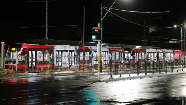 Test trams on Alison Rd, Randwick, where they were sent up and down the line with staff on board monitoring the electronics and a NSW Police Highway Patrol car following with flashing lights as a warning. Pictures: Bill Hearne