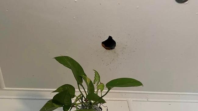 A can of Glen20 blasted this hole in the woman’s ceiling. Picture: Facebook/DYAD Constructions