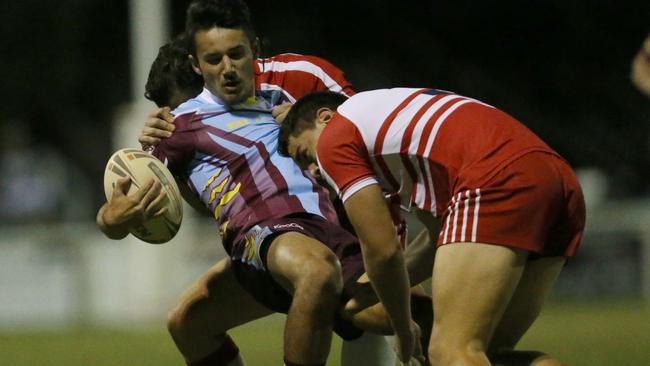 Jesse Arthars (with ball) in action for Keebra Park State High School being tackled by Gerrard Bailey (left) and Compain Sheziah of Palm Beach Currumbin State High. Picture: Regi Varghese