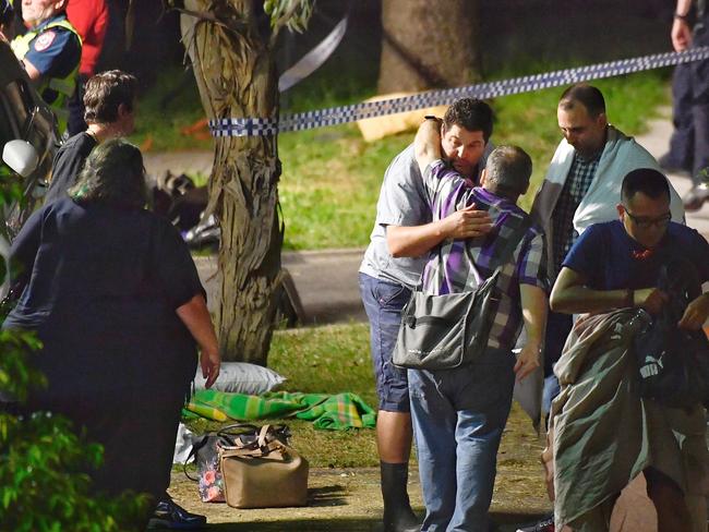 Walking wounded outside a police cordon at the scene. Picture: Jason Edwards