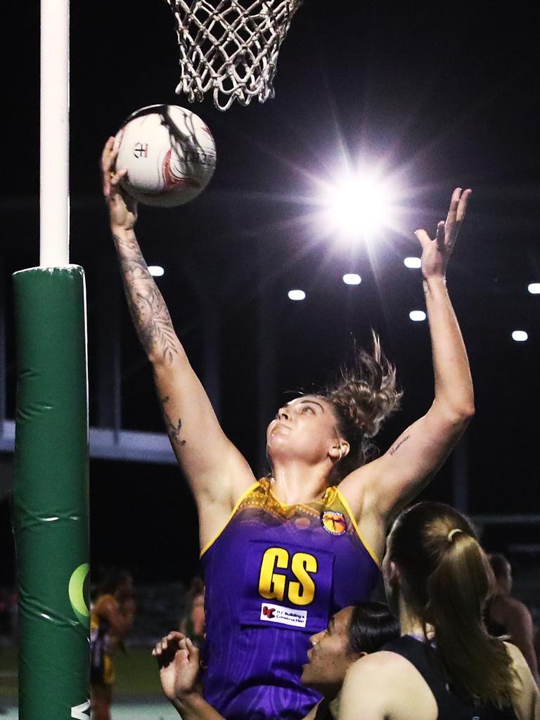 Fierce's Cayla George towers over the Saints players in the Cairns Netball Association Senior Division 1 match between the Phoenix Fierce and the Cairns Saints. PICTURE: BRENDAN RADKE