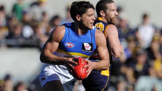 Dion Prestia runs the ball through the middle.