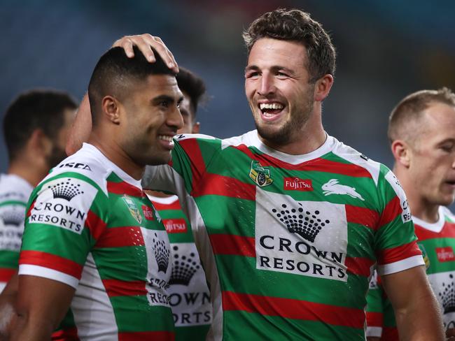 Robert Jennings of the Rabbitohs (L) celebrates with Sam Burgess (R) after scoring a try.