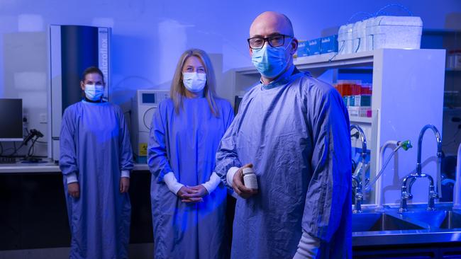 Head of clinical research unit at the Alfred Hospital in Melbourne James McMahon, clinical research co ordinator Michelle Hagenauer, centre, and Jessica Wisniewski, lab project manager. Picture: Wayne Taylor