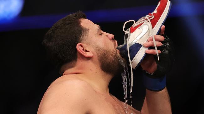LAS VEGAS, NEVADA - DECEMBER 11: Tai Tuivasa of Australia drinks from his shoe as he celebrates his knockout victory over Augusto Sakai of Brazil in their heavyweight fight during the UFC 269 event at T-Mobile Arena on December 11, 2021 in Las Vegas, Nevada. (Photo by Carmen Mandato/Getty Images)