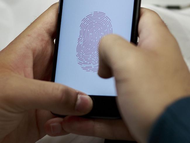 A customer sets the Touch ID of his new iPhone at an Apple store in Madrid in 2016. Picture: Gonzalo Arroyo Moreno/Getty Images