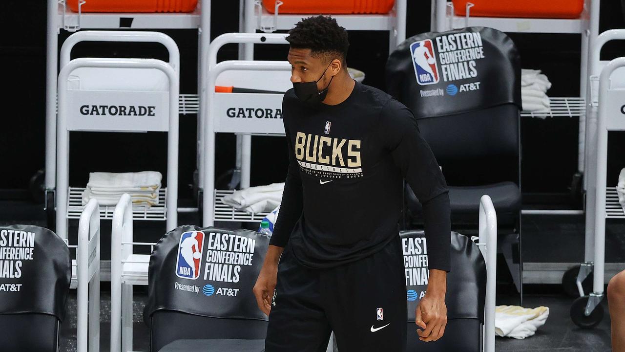 ATLANTA, GEORGIA - JULY 03: Giannis Antetokounmpo #34 of the Milwaukee Bucks reacts from the bench against the Atlanta Hawks during the second half in Game Six of the Eastern Conference Finals at State Farm Arena on July 03, 2021 in Atlanta, Georgia NOTE TO USER: User expressly acknowledges and agrees that, by downloading and or using this photograph, User is consenting to the terms and conditions of the Getty Images License Agreement. Kevin C. Cox/Getty Images/AFP == FOR NEWSPAPERS, INTERNET, TELCOS &amp; TELEVISION USE ONLY ==