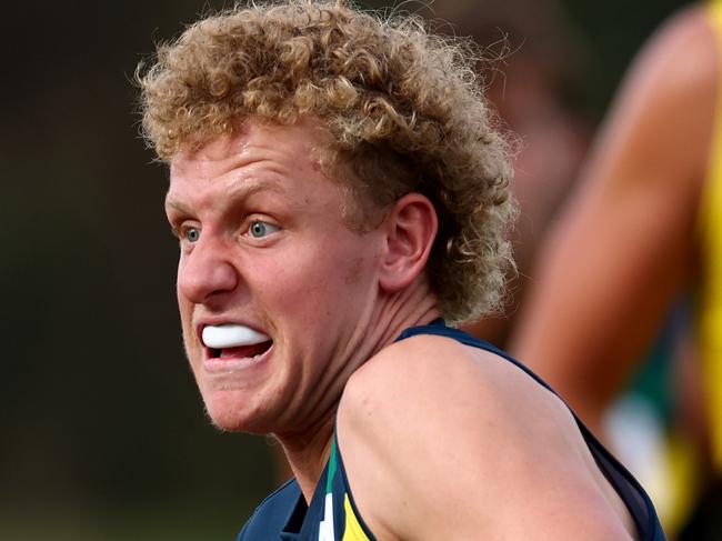 MELBOURNE, AUSTRALIA - APRIL 13: Matthew LeRay of the AFL National Academy is tackled during the Marsh AFL National Academy Boys match between Australia U18 and Richmond VFL at RSEA Park on April 13, 2025 in Melbourne, Australia. (Photo by Josh Chadwick/AFL Photos/via Getty Images)