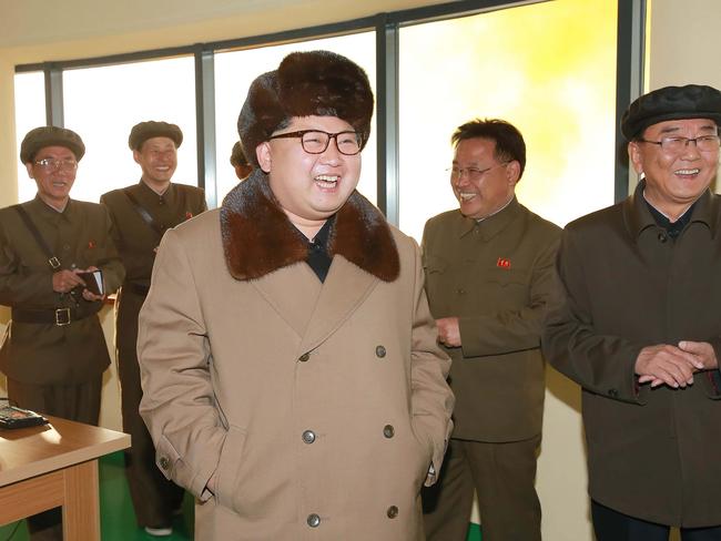 North Korean leader Kim Jong-Un (C) is keen to see his country land on the moon.  Picture:  AFP