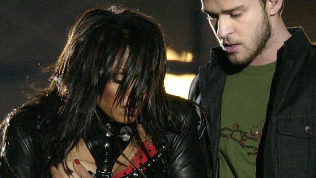 Entertainer Janet Jackson, covers her breast after her outfit came undone during the half time performance with Justin Timberlake at Super Bowl XXXVIII in Houston,Texas, in this  01/02/2004 file photo.