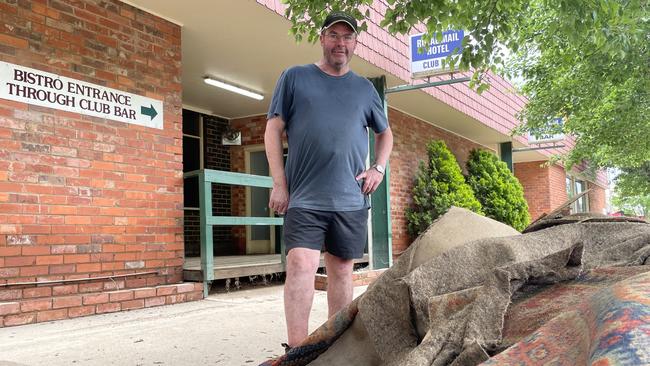 Trevor Forsyth, owner of Mooroopna's Royal Mail Hotel, with the flooded carpet he's had to pull out of his pub. Picture: Kiel Egging.