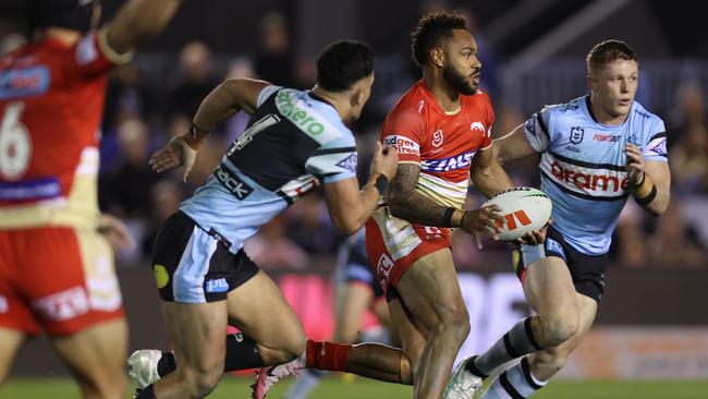 SYDNEY, AUSTRALIA - JUNE 13: Hamiso Tabuai-Fidow of the Dolphins makes a break to score a try during the round 15 NRL match between Cronulla Sharks and Dolphins at PointsBet Stadium on June 13, 2024 in Sydney, Australia. (Photo by Jason McCawley/Getty Images)