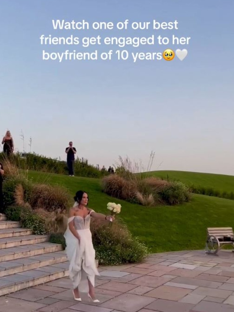 The bride prepared to throw her bouquet – only to turn and walk toward a friend in the crowd. Picture: TikTok