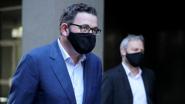 Victorian Premier Daniel Andrews and Chief Health Officer Brett Sutton arrive at a press conference in Melbourne of Friday. Picture: NCA NewsWire / David Geraghty