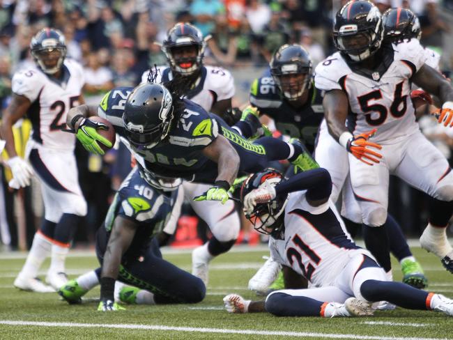 Seattle Seahawks running back Marshawn Lynch dives in for the game-winning touchdown.