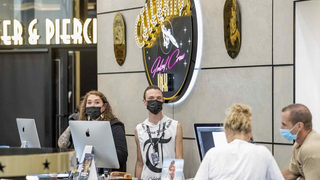 Staff at Celebrity Ink Surfers Paradise in face masks before the studio was forced to shut its doors during the coronavirus pandemic. Picture: Jerad Williams