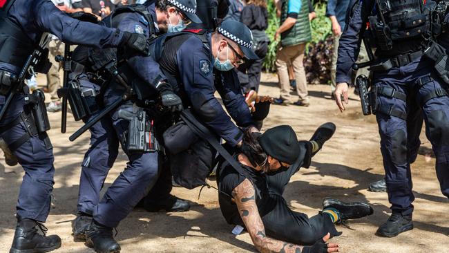 Police tackle a protester at an anti-vax, anti-lockdown march in Melbourne this month. Picture: NCA NewsWire/Sarah Matray