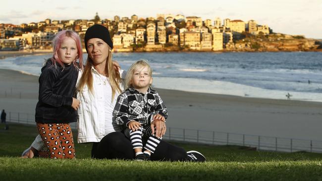 Carrie Christensen, with her children Coco Fahey (5) and Spike Fahey (2). The family were turned away from Bondi Beach for exercise. Picture: John Appleyard