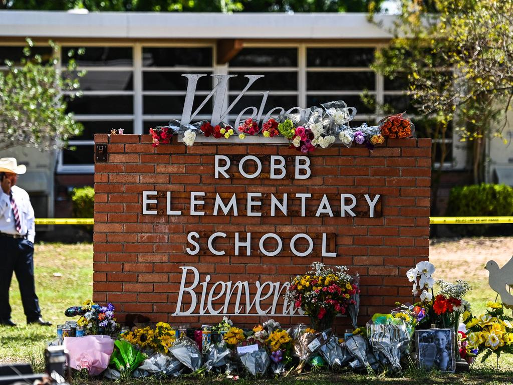 A makeshift memorial has been erected in memory of the children, and the schoolteacher who lost their lives in the latest mass shooting. Picture: Chadan Khanna/AFP