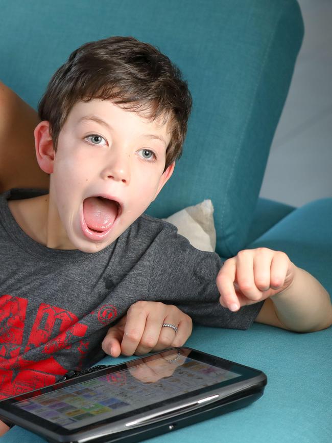 Harry uses two speech-generating devices to communicate. Picture: AAP / Russell Millard