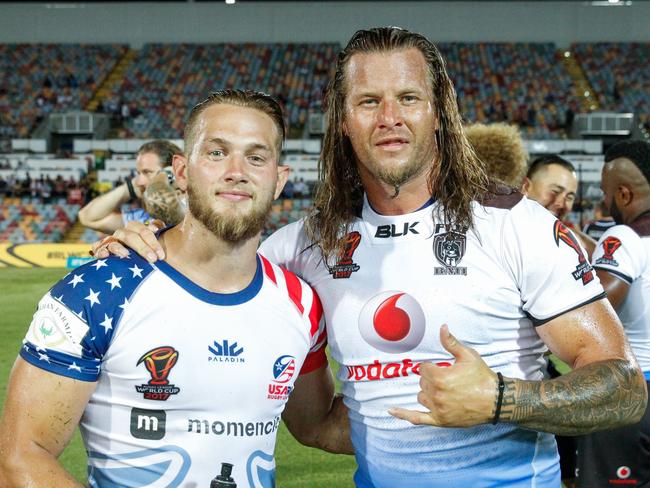 Fiji’s Ashton Sims (R) with the USA’s Ryan Burroughs after their World Cup clash. Pic: AAP