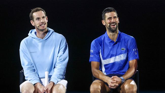 TOPSHOT - Britainâs Andy Murray (L) reacts with Serbiaâs Novak Djokovic during a charity event titled âNight with Novakâ on Rod Laver Arena in Melbourne on January 9, 2025 ahead of the Australian Open tennis championship starting on January 12. (Photo by DAVID GRAY / AFP) / -- IMAGE RESTRICTED TO EDITORIAL USE - STRICTLY NO COMMERCIAL USE --