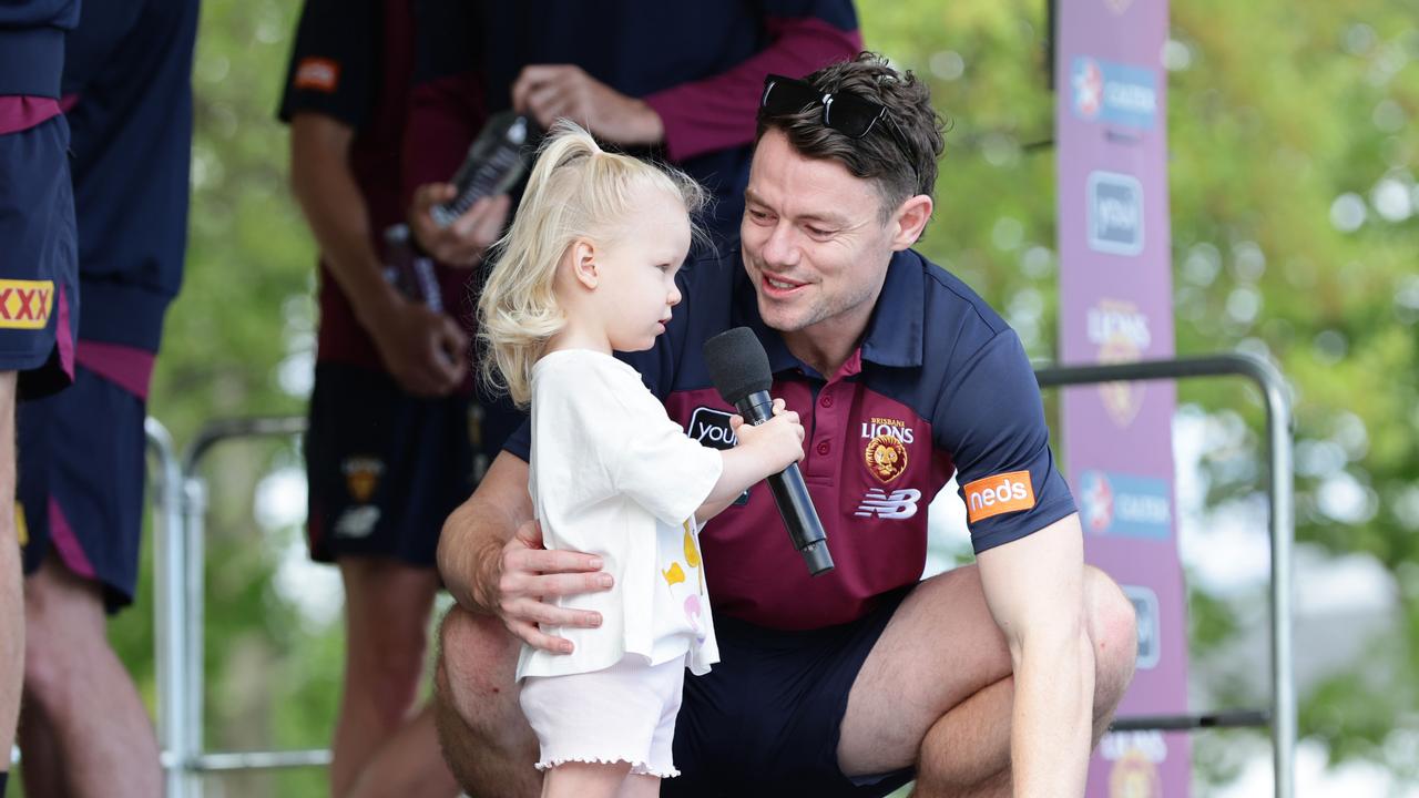 Lachie Neale on stage with daughter Piper at the Lions fan day on Sunday. Picture: Lachie Millard