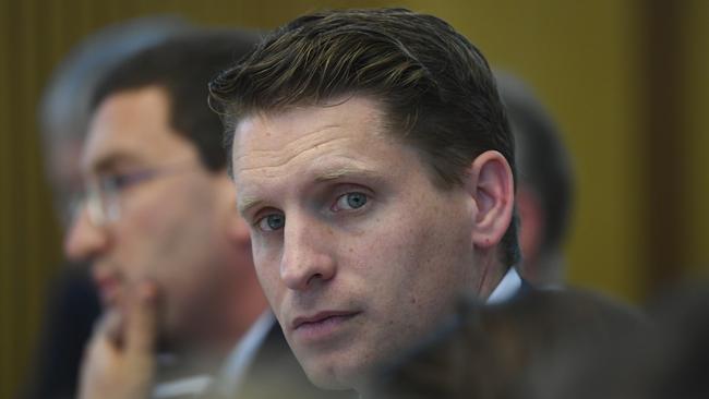 Committee chair Andrew Hastie reacts during a hearing of the Parliamentary Joint Committee on Intelligence and Security at Parliament House in Canberra, Wednesday, July 31, 2019. (AAP Image/Lukas Coch) NO ARCHIVING