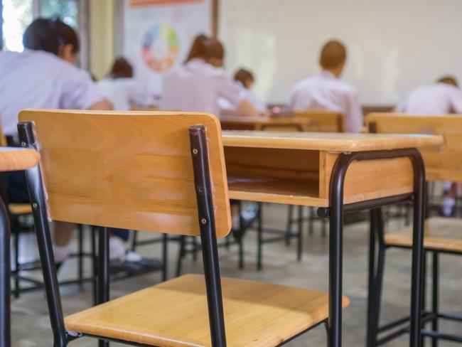 Lecture room or School empty classroom with Student taking exams, writing examination for studying lessons in high school thailand, interior of secondary education, whiteboard. educational concept