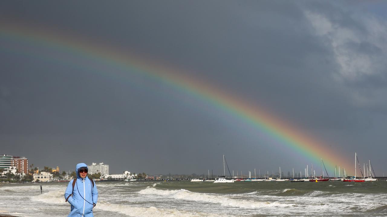 A man walks along Beaconsfield Pde South Melbourne as wild weather sweeps across the state. Picture: NewsWire/Ian Currie