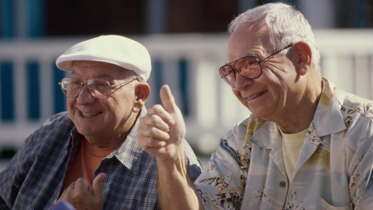 Two senior men smiling