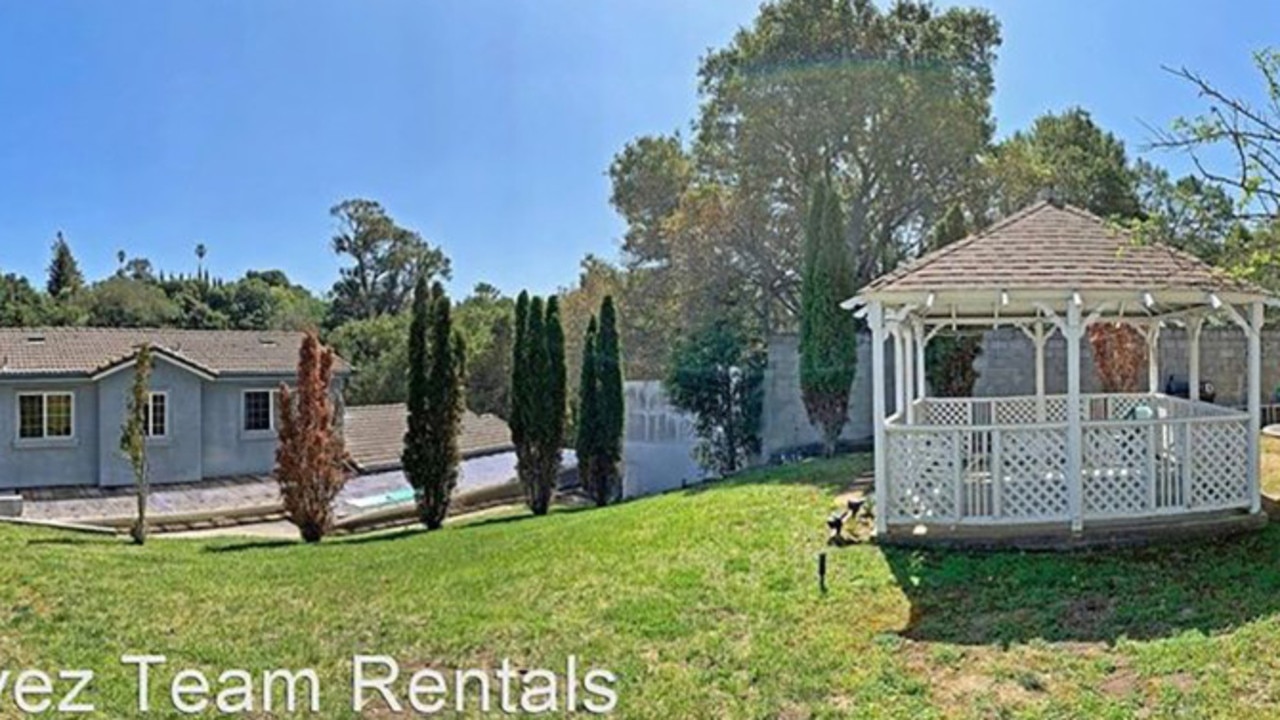 Another view of the expansive backyard looking into the blue-cemented house. Picture: Realtor