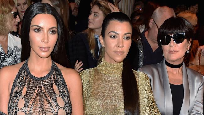 Kim Kardashian, Kourtney Kardashian and Kris Jenner at 2016’s Paris Fashion Week. Picture: Pascal Le Segretain / Getty Images.