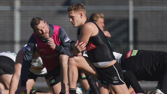 Nathan Buckley speaks to Treloar during happier times. Picture: AAP Image/Michael Dodge