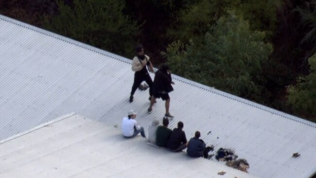 Inmates shadow boxing on top of the Banksia Hill Juvenile Detention Centre. Picture: Nine