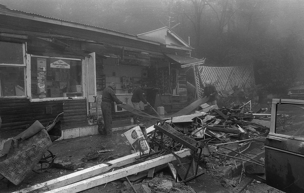 Historic: Toowoomba: Accidents: Clean up at the Log Cabin Service Station the morning after a semi-trailer rolled and crashed in the building removing most of the front of the station. The owner in 1978, Mr Neville Hammond started rebuilding immediately. Photo: Bruce Mackenzie / The Chronicle Neg: U875. Picture: Bruce Mackenzie