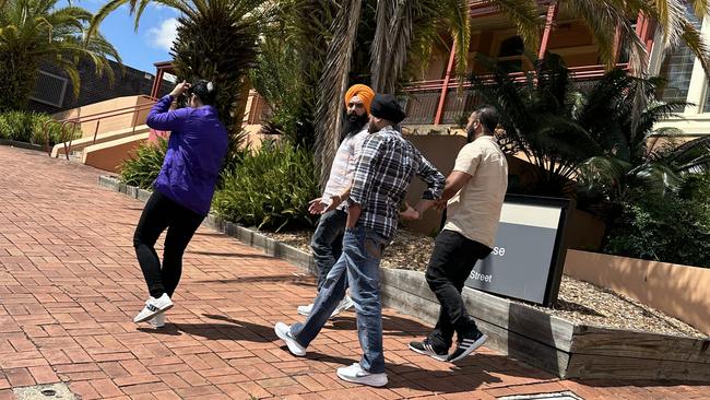 Lovepreet Singh, (in orange turban) with support leaving Lismore Courthouse.