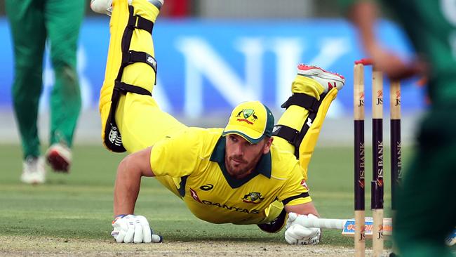 Australian cricketer Aaron Finch slides home against Pakistan overnight. Picture: AFP