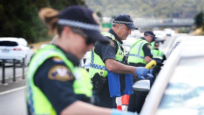 Tasmania Police members conducting licence and breath tests at Kingston during the launch of Tasmania Police’s Operation Crossroads for the 2020 Christmas period. Picture: NIKKI DAVIS-JONES