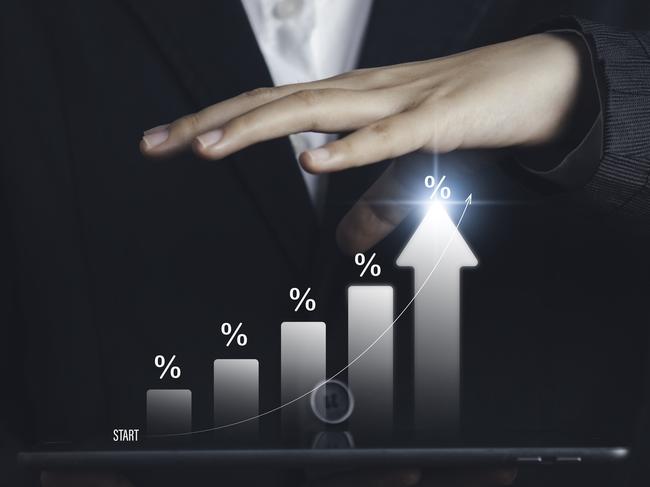 l businessman calculating investment income on a tablet with percentage symbol and up arrow, Interest rates continue to increase, return on stocks compound interest generic