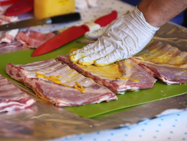 Ricki Brideoake prepares the meat cuts. Photo: Bob Barker.