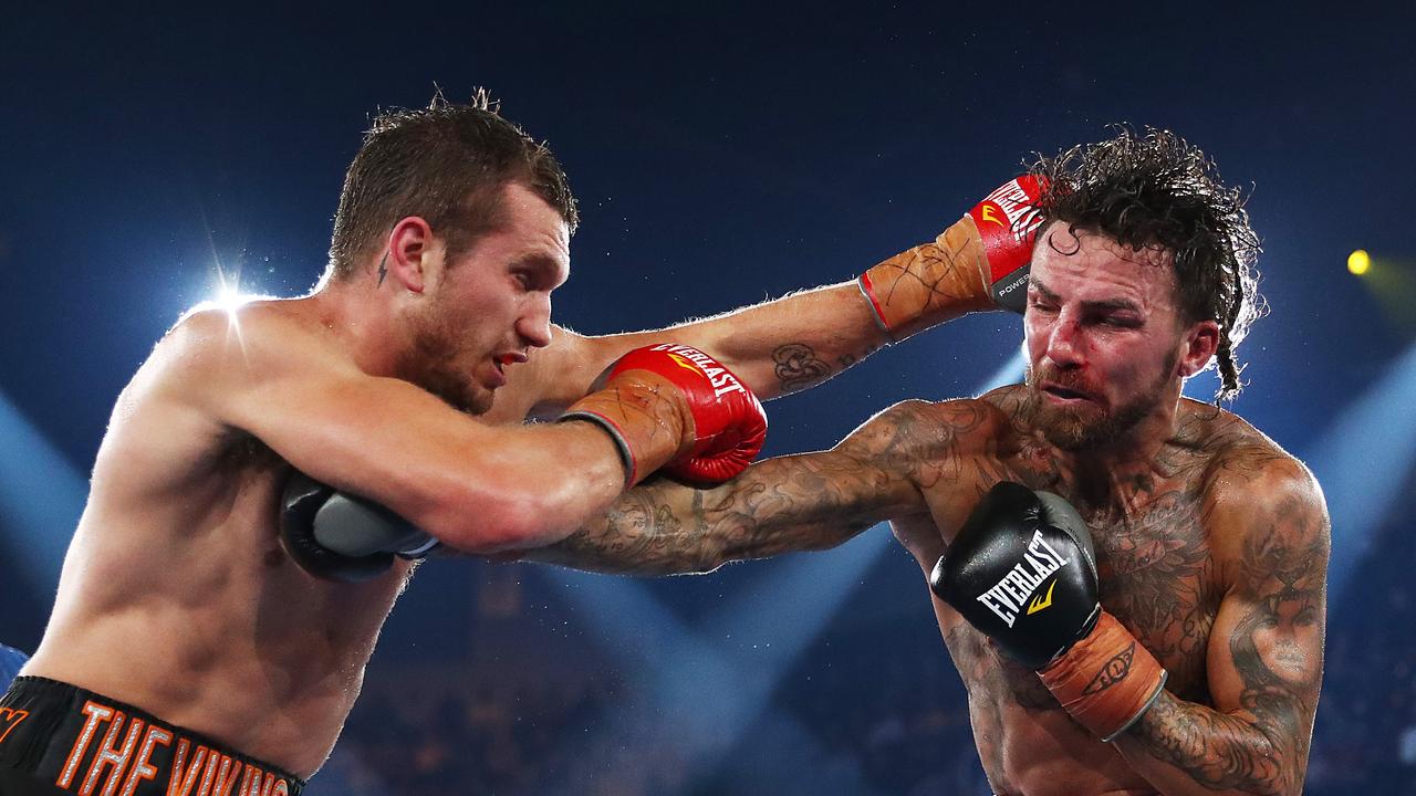 Jack Brubaker (R) punches Stevie Spark in their sensational bout. (Photo by Mark Metcalfe/Getty Images)
