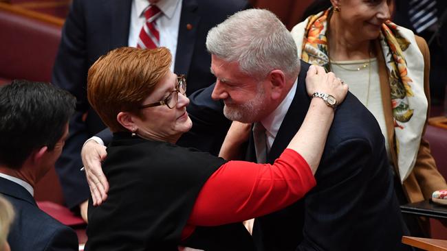 Minister for Foreign Affairs Marise Payne hugs Liberal Senator Mitch Fifield. Picture: AAP