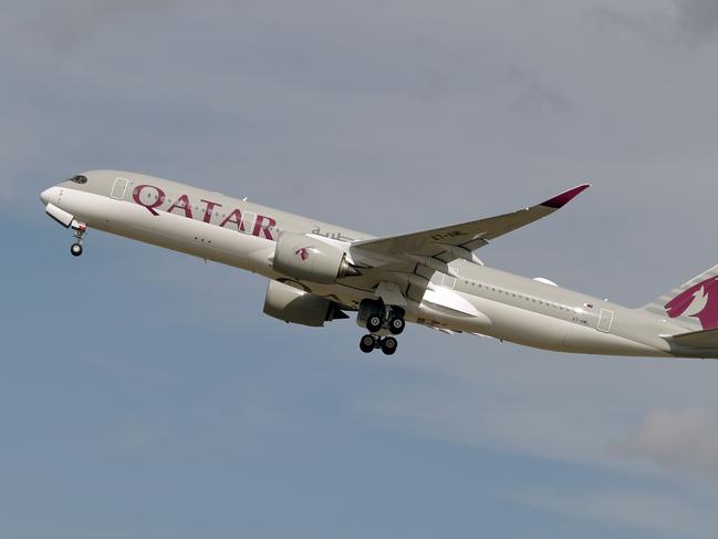 (FILES) This file photo taken on September 27, 2019 shows a Qatar Airways Airbus A350 aircraft taking off from Toulouse-Blagnac airport, near Toulouse. - Revelations that passengers flying through Doha were forced to endure vaginal inspections have upended Qatar's efforts to boost its reputation before the Gulf state hosts World Cup 2022, experts say. Officers marched women off a Sydney-bound Qatar Airways flight earlier this month and forced them to undergo intimate examinations after a newborn baby was found abandoned in an airport bathroom. (Photo by PASCAL PAVANI / AFP)