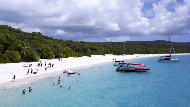 Tourists on Whitehaven Beach in the Whitsundays. Picture: Getty Images