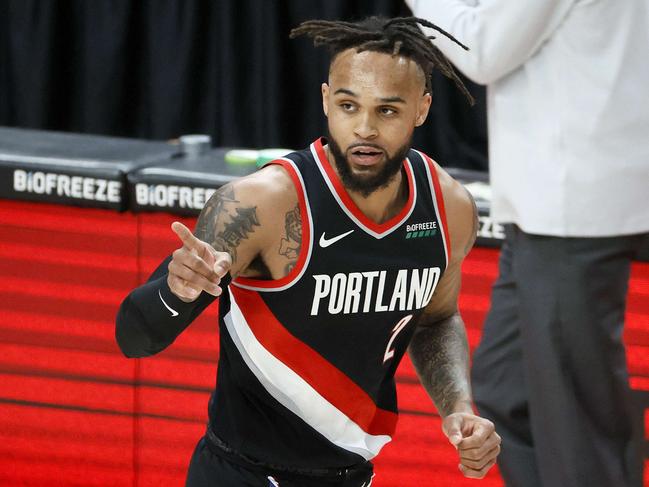 PORTLAND, OREGON - MARCH 23: Gary Trent Jr. #2 of the Portland Trail Blazers reacts after his three point basket against the Brooklyn Nets during the second quarter at Moda Center on March 23, 2021 in Portland, Oregon. NOTE TO USER: User expressly acknowledges and agrees that, by downloading and or using this photograph, User is consenting to the terms and conditions of the Getty Images License Agreement.   Steph Chambers/Getty Images/AFP == FOR NEWSPAPERS, INTERNET, TELCOS & TELEVISION USE ONLY ==