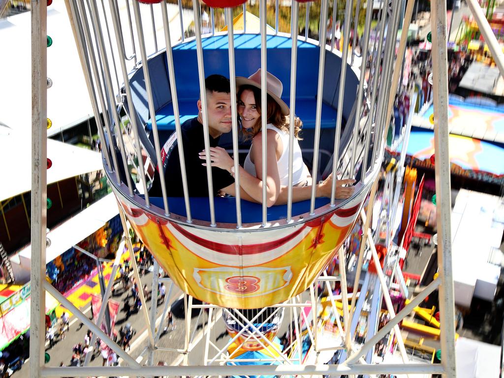 Young couple Sam Dargham 19 and Kyra King 19 enjoy a ride on the Ferris wheel. Picture: Toby Zerna